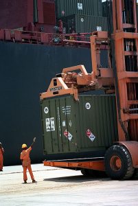 Dockworker and cargo containers
