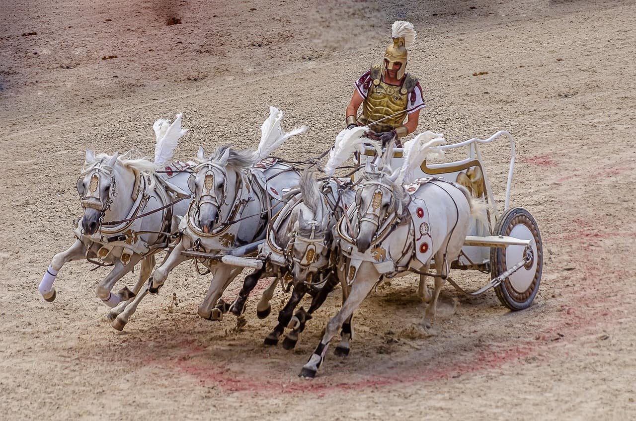 Roman chariot with four white horses.