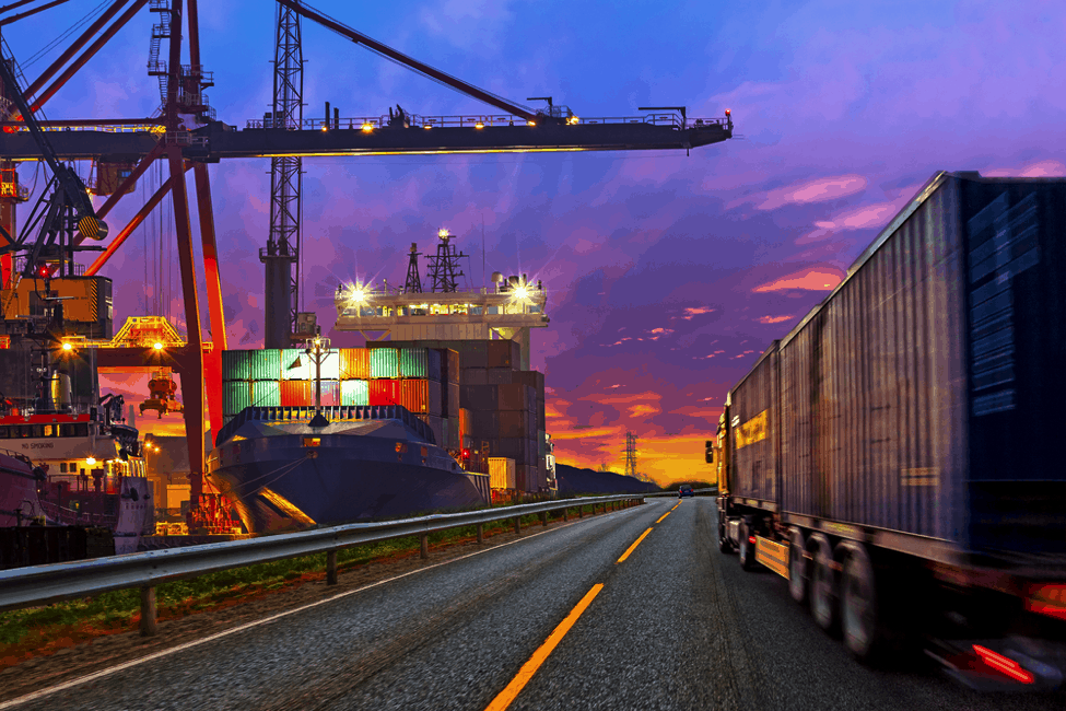 Container Ship at Dock Truck on Road.png