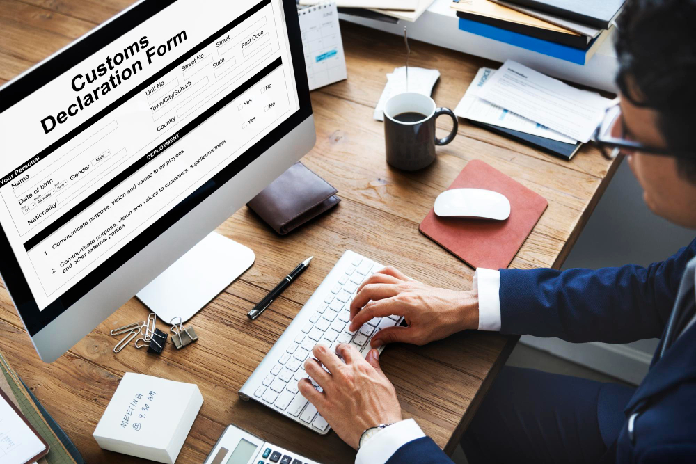 a man setting up his customs regulations when shipping on an Apple computer