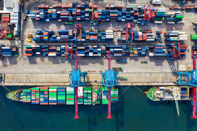 A birds-eye view of container ships, representing success and failure stories from the import and export business